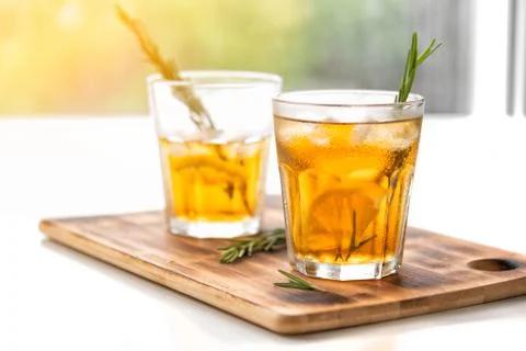 Glasses with refreshing drinks on a window background. two glasses with lemon Stock Photos