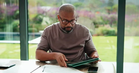 Glasses, remote work or black man with tablet in home, accounting audit or Stock Footage 335512238