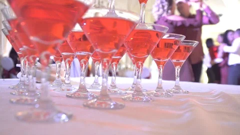 Glasses in the restaurant on the background of dancing people Stock Footage 85674755