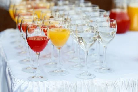 Glasses in a row at a buffet table Stock Photos