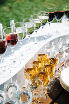 Glasses in a row at the event, various drinks Stock Photos
