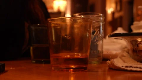 Glasses Set at Dinner Table with Ambient Light Stock Footage 335961034