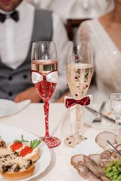 Glasses with sparkling wine on the table Stock Photos