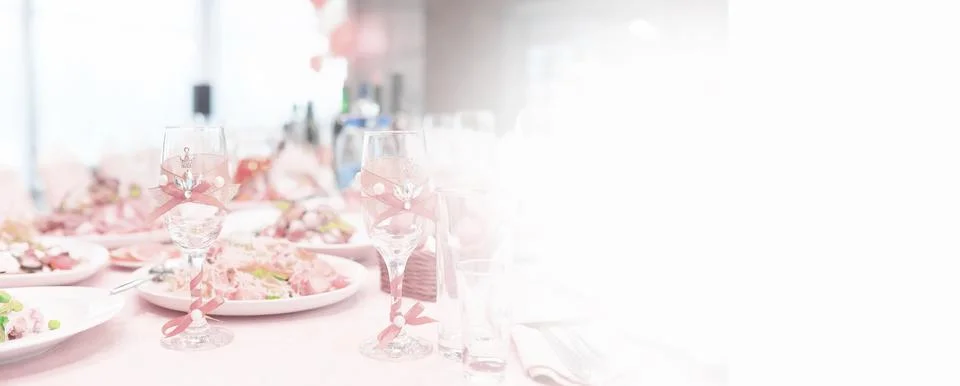 Glasses on the table in the restaurant. Table setting. Stock Photos