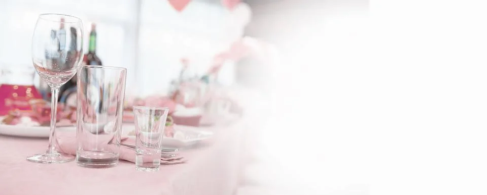 Glasses on the table in the restaurant. Table setting. Stock Photos