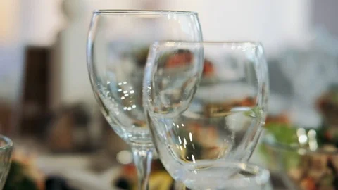Glasses on the table. Served table in a restaurant. Video stock 129136657