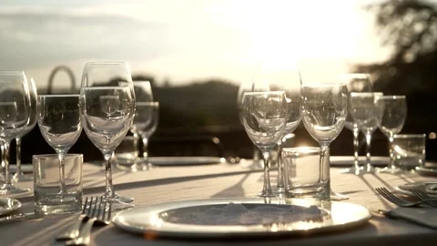 Glasses on the table at sunset Stock Footage 167700638