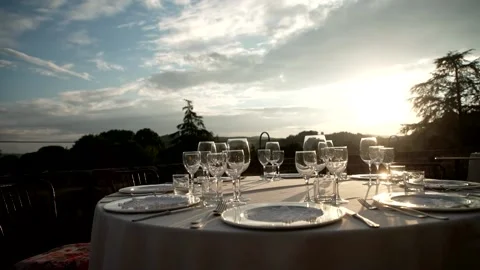 Glasses on the table at sunset Stock Footage 167700811
