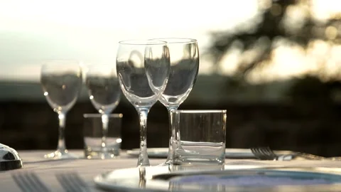 Glasses on the table at sunset Stock Footage 167701763