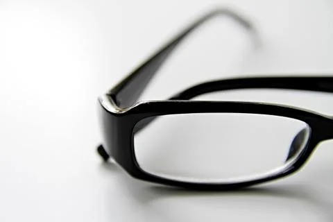 Glasses on a table with white background Stock Photos