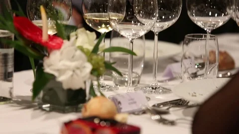 Glasses on the table who contain white wine Stock Footage 74229474