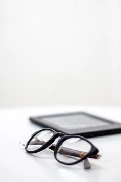 Glasses tablet white background Stock Photos