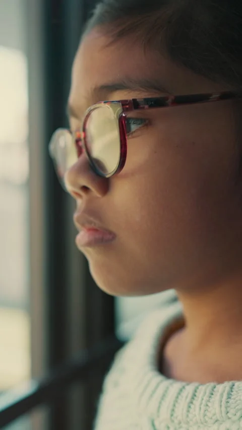 Glasses, thinking and sad with child at window in home for memory, abandoned and Stock Footage 332895173