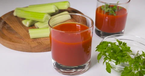 Glasses of tomato juice on the table Stock Footage 167475941