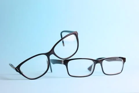 Glasses for vision correction on a colored background with space for text Foto stock
