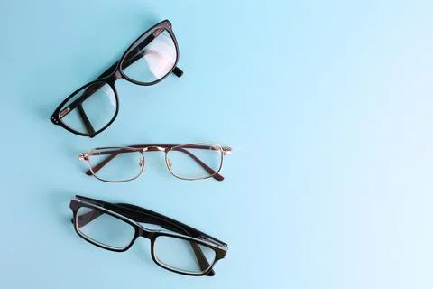 Glasses for vision correction on a colored background with space for text Foto stock