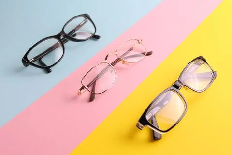 Glasses for vision correction on a colored background with space for text Stock Photos