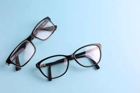 Glasses for vision correction on a colored background with space for text Stock Photos