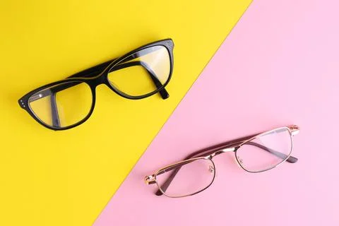 Glasses for vision correction on a colored background with space for text Stock Photos