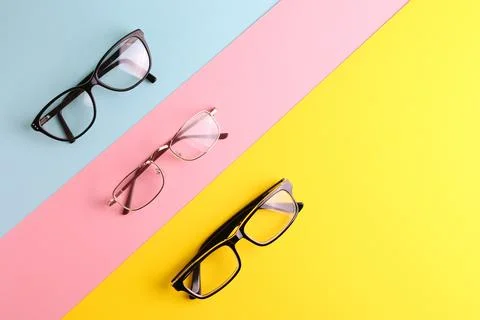 Glasses for vision correction on a colored background with space for text Foto stock