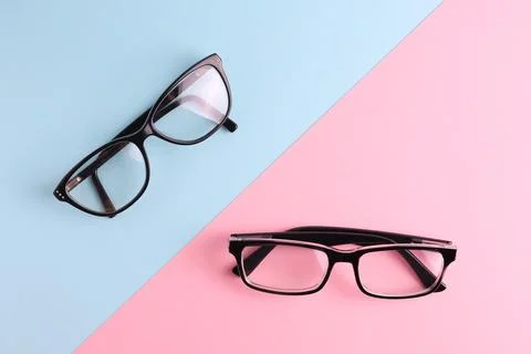 Glasses for vision correction on a colored background with space for text Foto stock