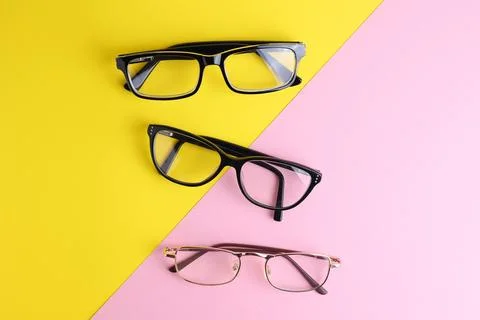 Glasses for vision correction on a colored background with space for text Foto stock