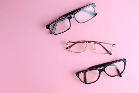 Glasses for vision correction on a colored background with space for text Foto stock