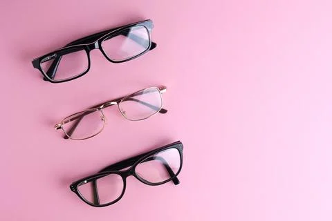 Glasses for vision correction on a colored background with space for text Stock Photos