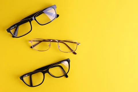 Glasses for vision correction on a colored background with space for text Stock Photos