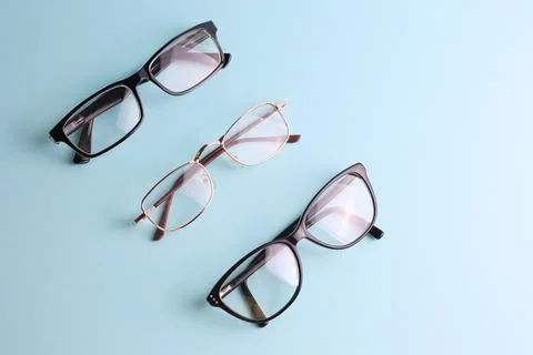 Glasses for vision correction on a colored background with space for text Stock Photos