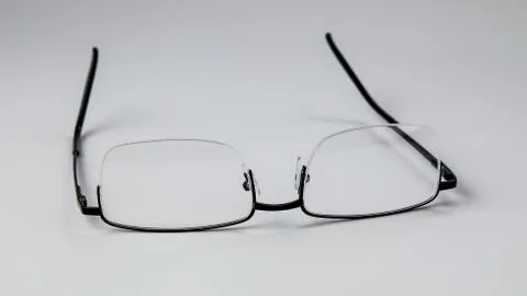 Glasses for vision on a light background. Stock Photos
