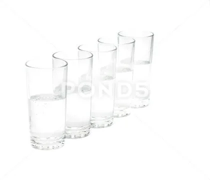 Glasses with water isolate on white background Stock Photos
