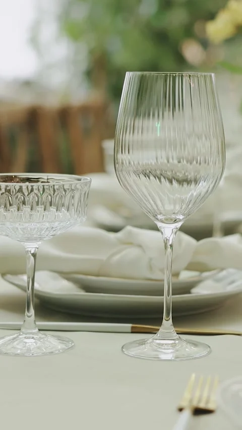 Glasses on a wedding dinner table. We serve tables for a wedding or a special Stock Footage 308453134