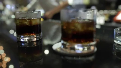Glasses of whiskey on the bar Stock Footage 79934674