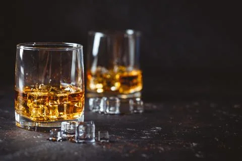 Glasses of whiskey with ice Stock Photos