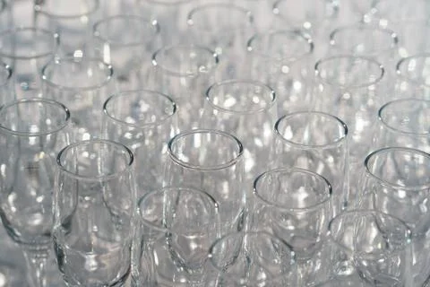 Glasses of white wine in a row on the table in pyramid Stock Photos