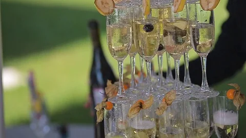 Glasses with wine or champagne on the table. Champagne slide Stock Footage 82585508