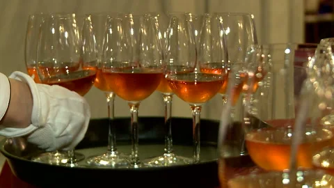 Glasses of wine on the spacing. Secular supper. Meeting with guests Stock Footage 90052077