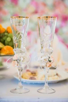 Glasses for wine on the table with romantic blurred background Stock Photos
