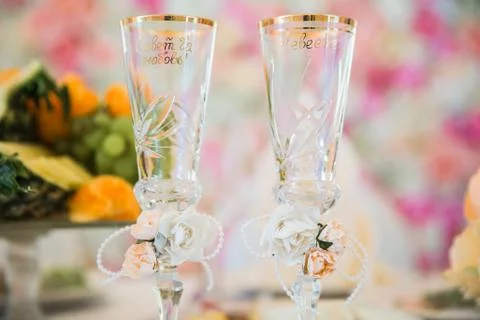 Glasses for wine on the table with romantic blurred background Stock Photos