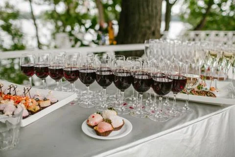 Glasses of wine on the table seating Stock Photos