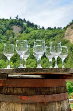 Glasses for wine testing on an old wine barrel Stock Photos