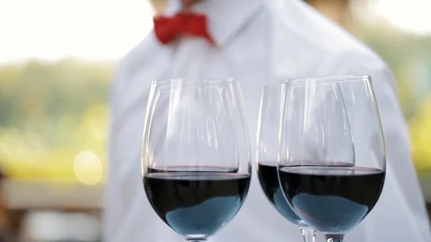 Glasses with wine on a tray Stock Footage 78607615