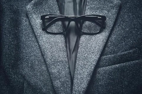 Glasses on workman's jacket Stock Photos