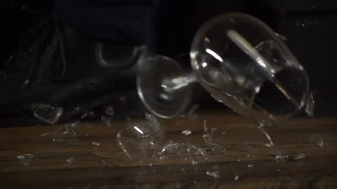 Glassware falling to the ground and bouncing and shattering in slow motion Stock Footage 101311136