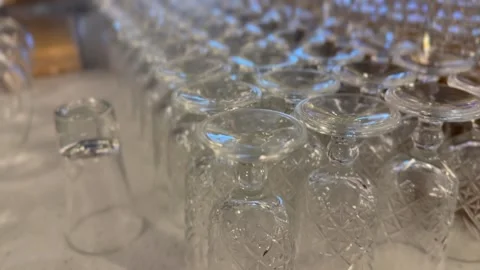 Glassware with intricate patterns arranged on a table for event or celebrat.. Stockbeeldmateriaal 324811085