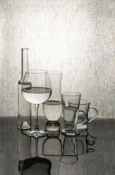 Glassware with liquid on a tabletop with reflection Fotos Stock
