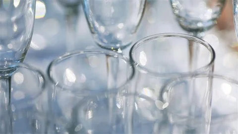 Glassware macro close up. Rims of empty glasses set for sparkling wine prepared Stock Footage 71290458