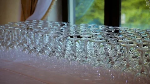 Glassware macro close up. Rims of empty glasses set for sparkling wine prepared Stock Footage 76346400
