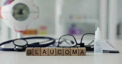 Glaucoma written on background of glasses for vision and eye drops closeup 4k Stock Footage 252602026